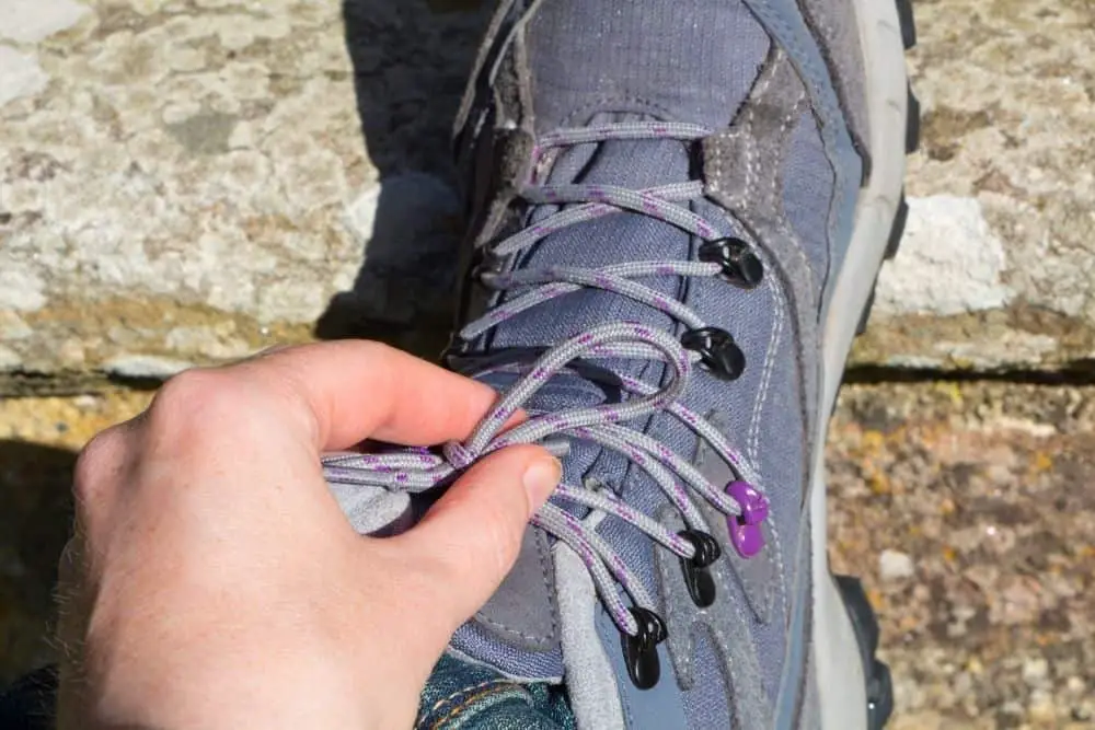 loosen shoelaces of hiking boots to prevent hugging your ankles too much