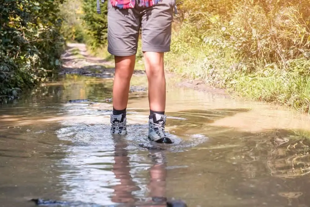 waterproof hiking boots pass through a puddle in Joshua Tree