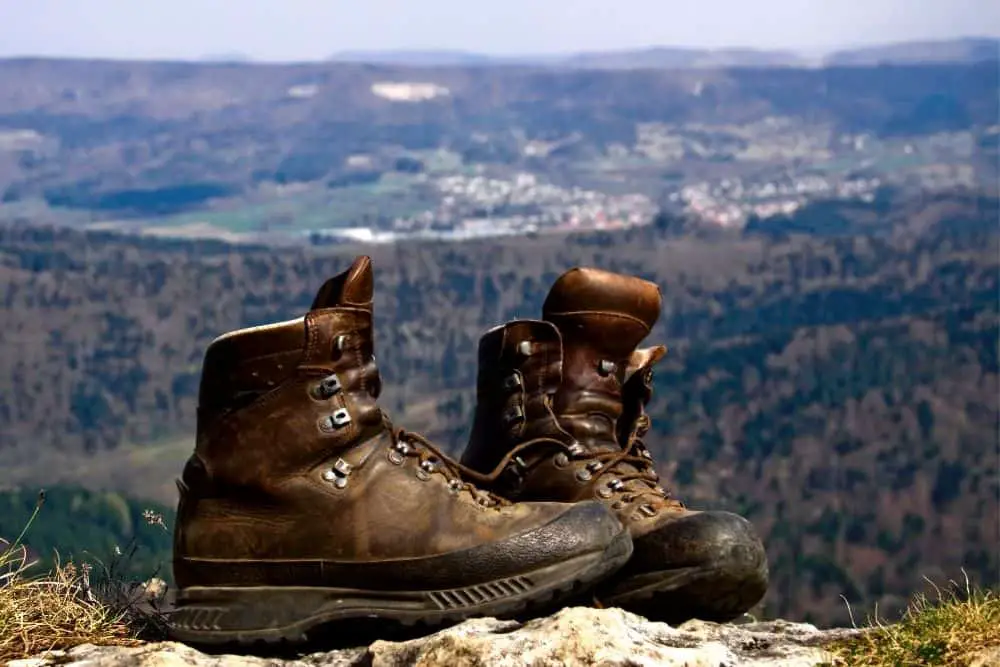 a pair of brown leather hiking boots