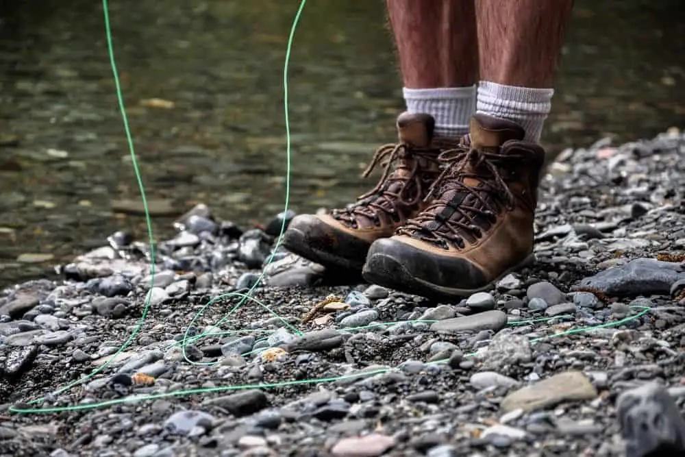 man wearing white socks and lightweight hiking boots