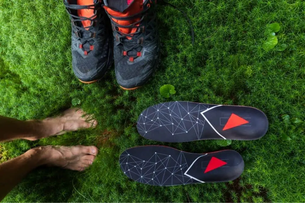people feet, insoles and hiking boots