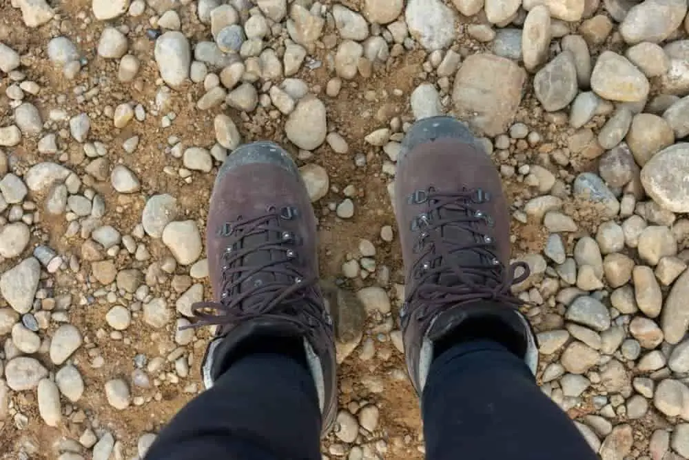 running with hiking boots on pebble strewn path