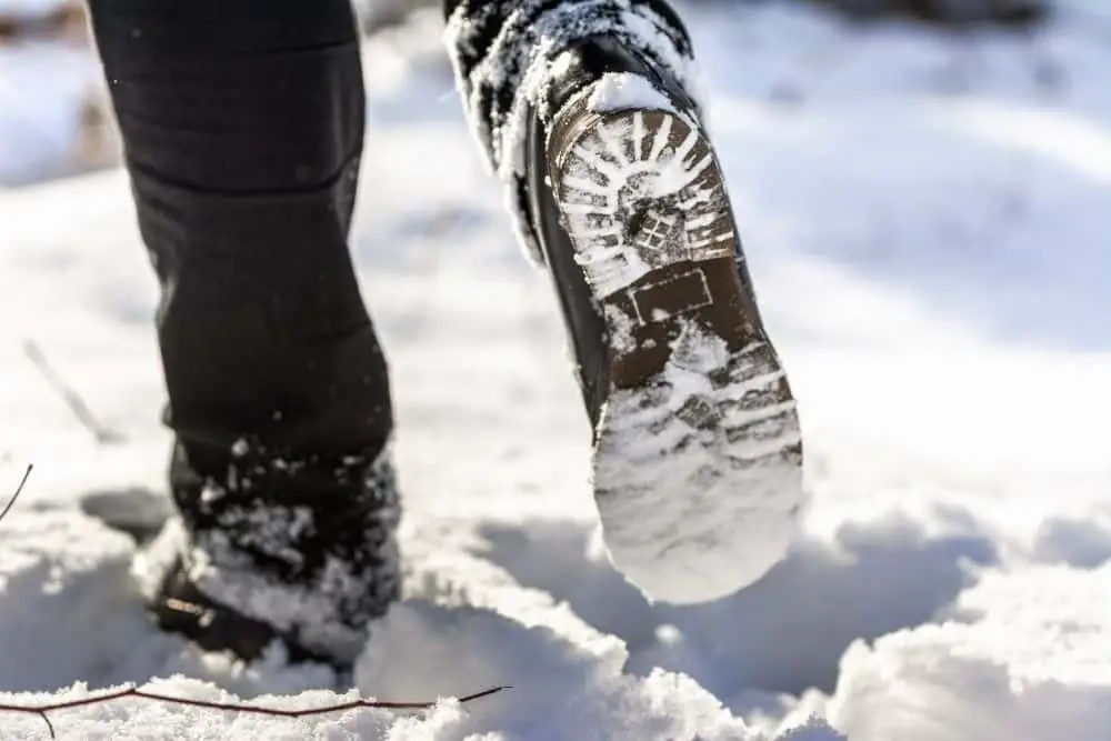 slippery tread of hiking boots on snow