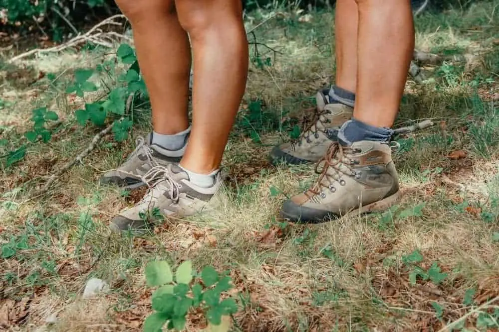 two men wear stiff hiking boots with ankle support