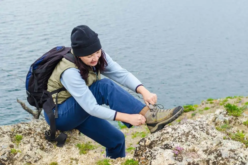girl lacing her hiking boots