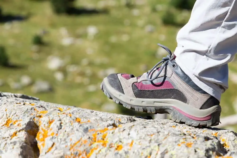 hiking boots with heels on a rock