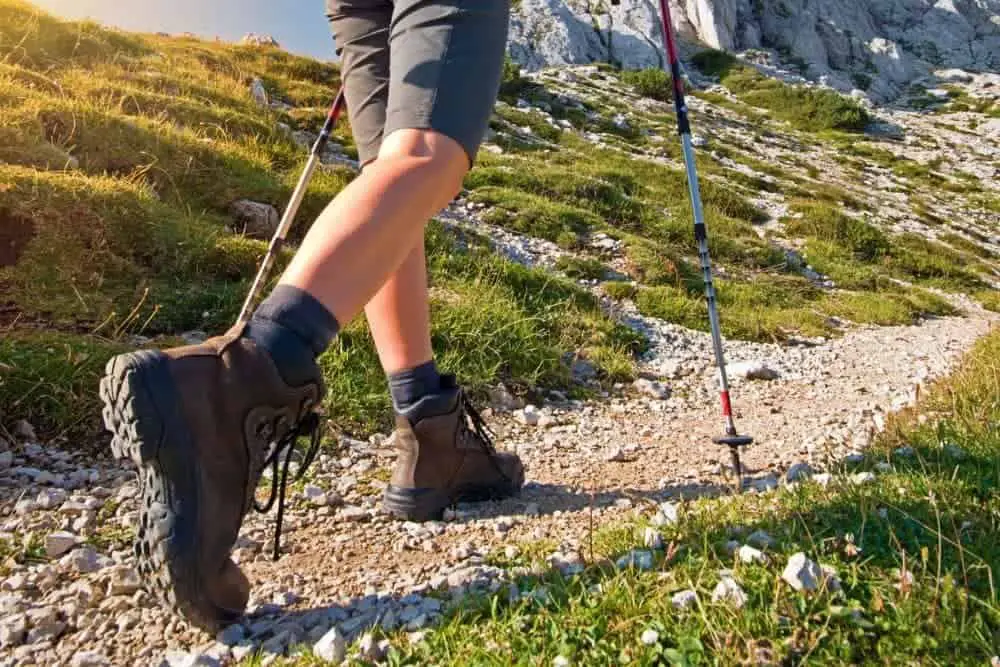 hiking boots with heels on stony road