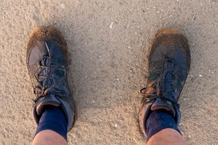 hiking boots with wet sand