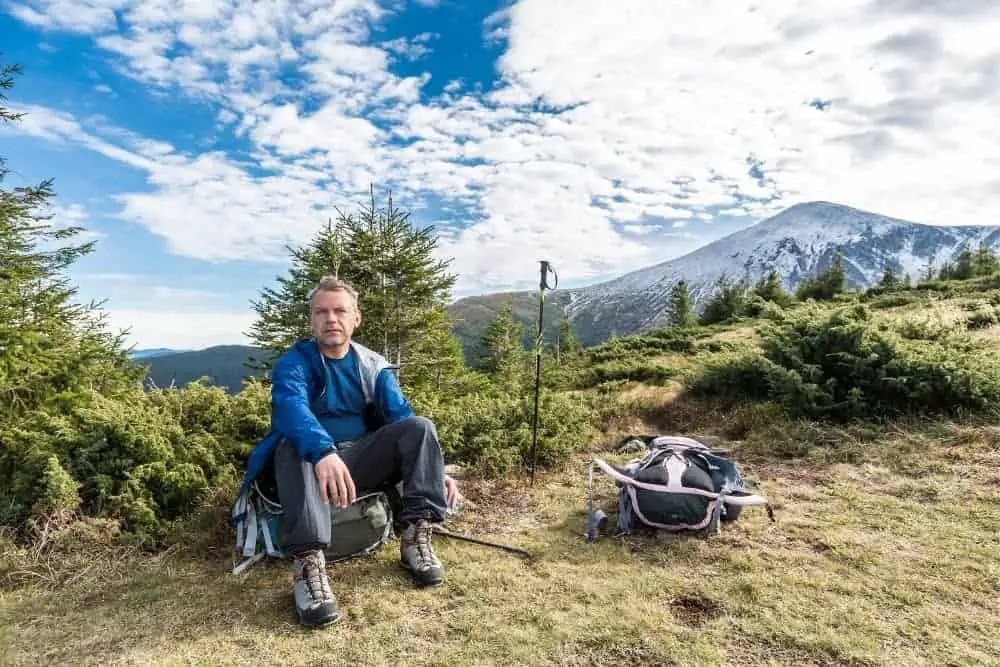 man are uncomfortable with tight hiking boots