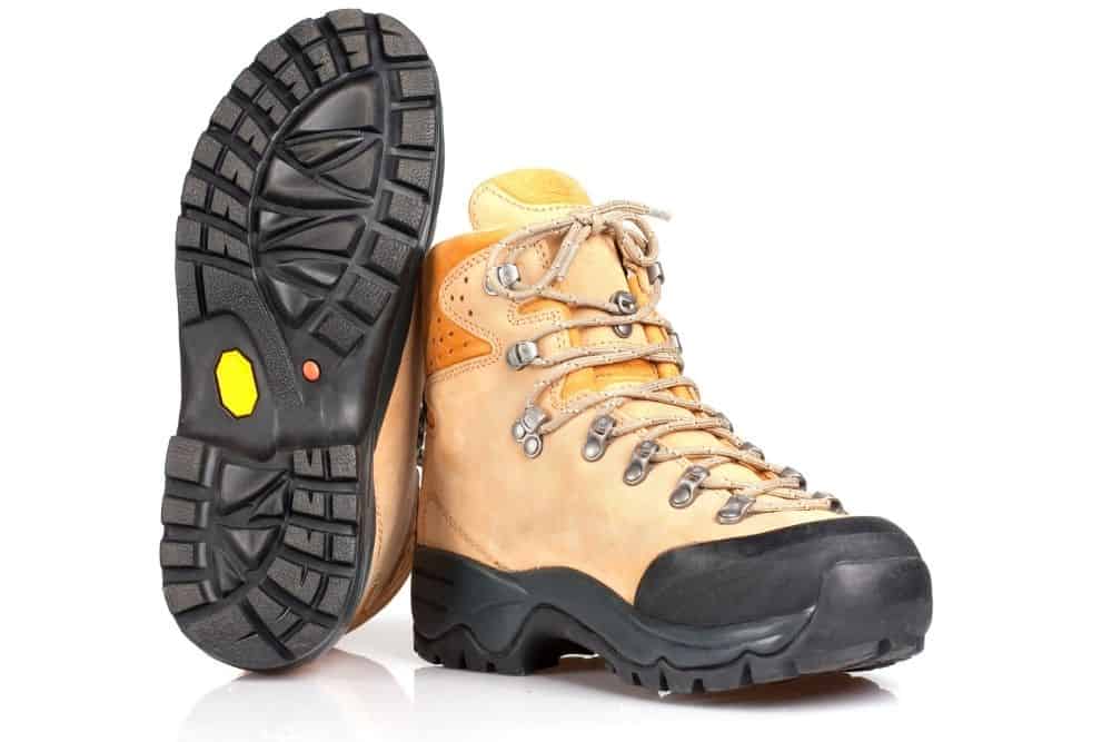 rubber outsoles of light orange heavy hiking boots