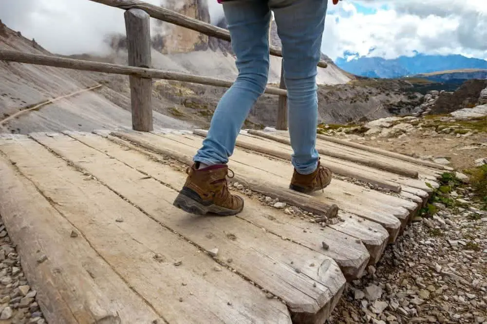 woman treads hiking trail carefully