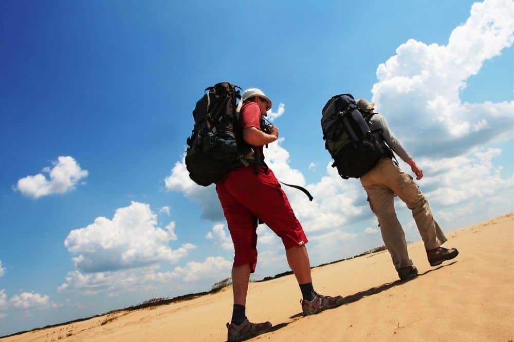 2 mens hike in the desert