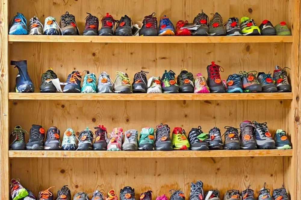 Many pairs of hiking boots with variety materials