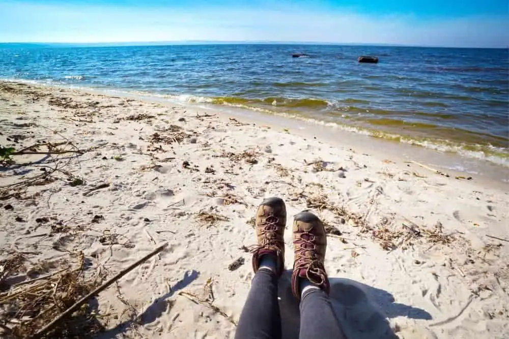 hiking boots on sandy beach