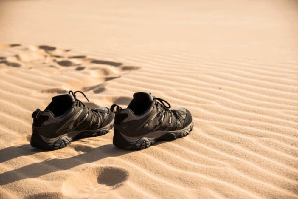 hiking boots with vented holes on sand