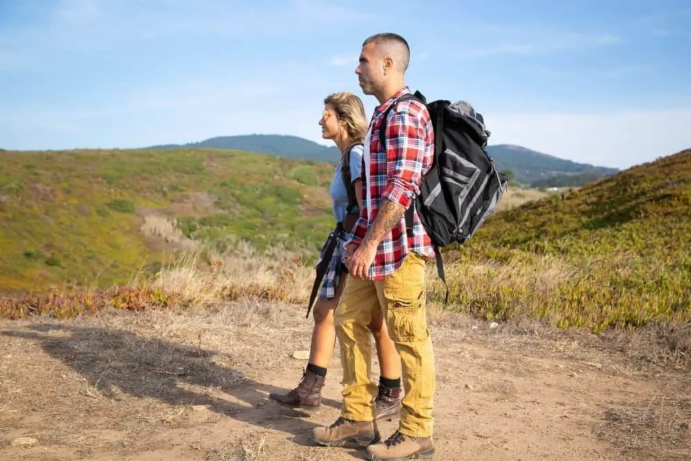 man wears cargo pants with hiking boots