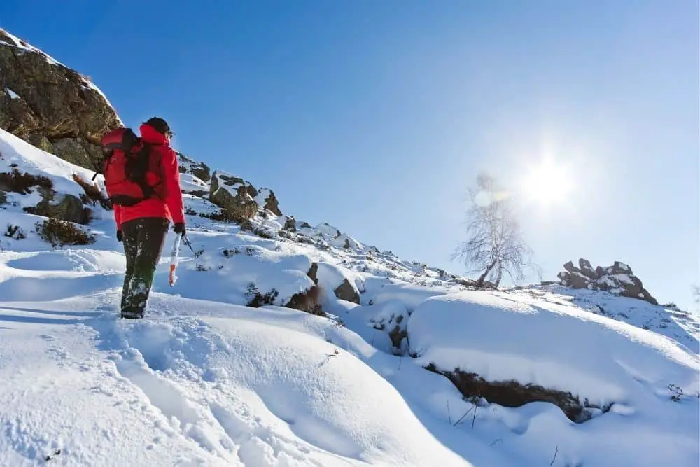 tuck pants inside hiking boots to keep warm on snowy terrain