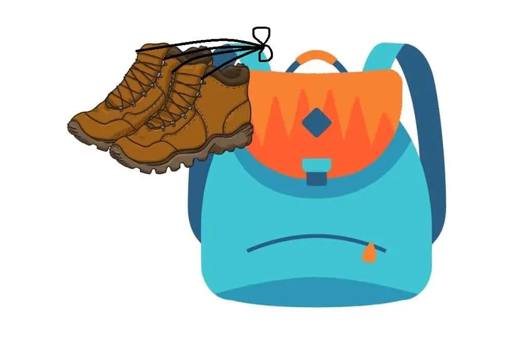 tying a pair of hiking boots to one shoulder strap of backpack