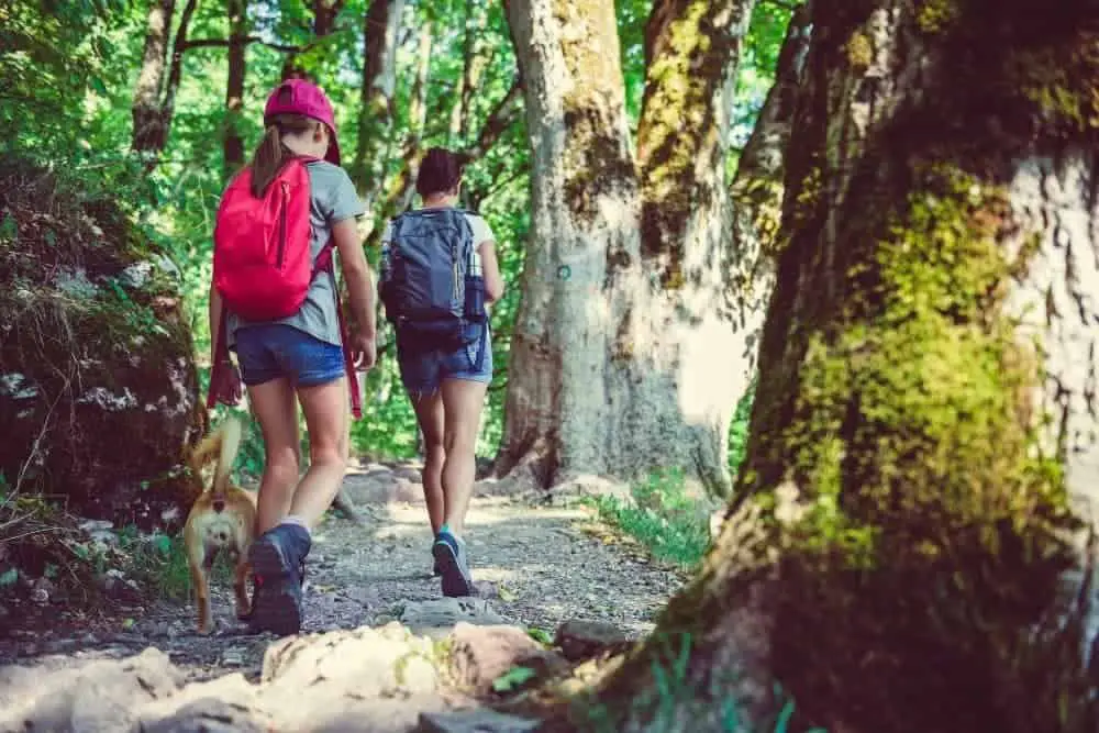 woman and her friend wear shorts with hiking boots