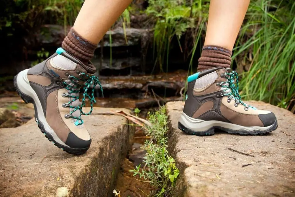 Women wear hiking boots walking in the rocky stands