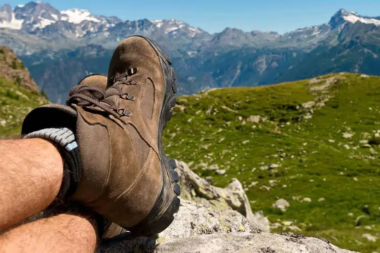 man wearing overstretching hiking boots