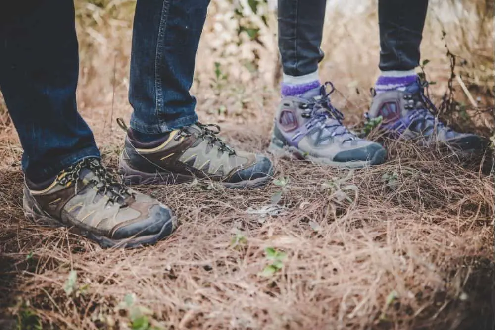 two people wear broken in hiking boots