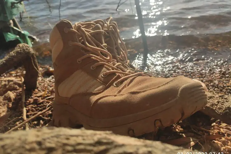 Hiking boots near the lake