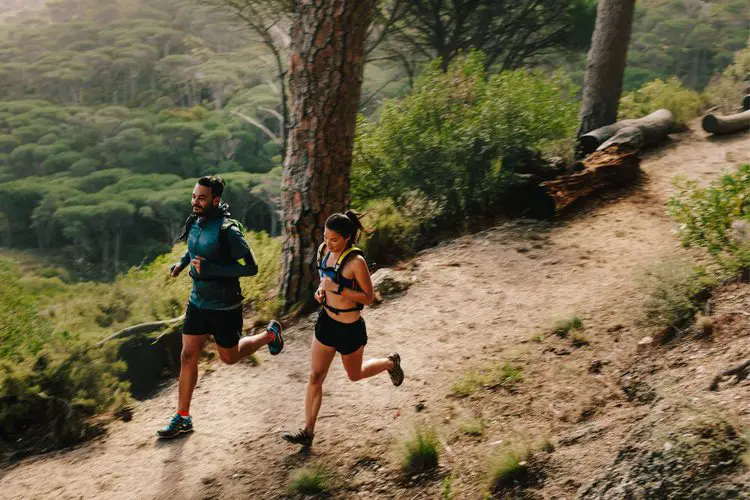 Man and woman are running on the trails