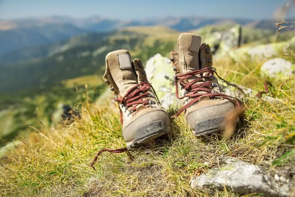 A pair of suede hiking boots on the hill