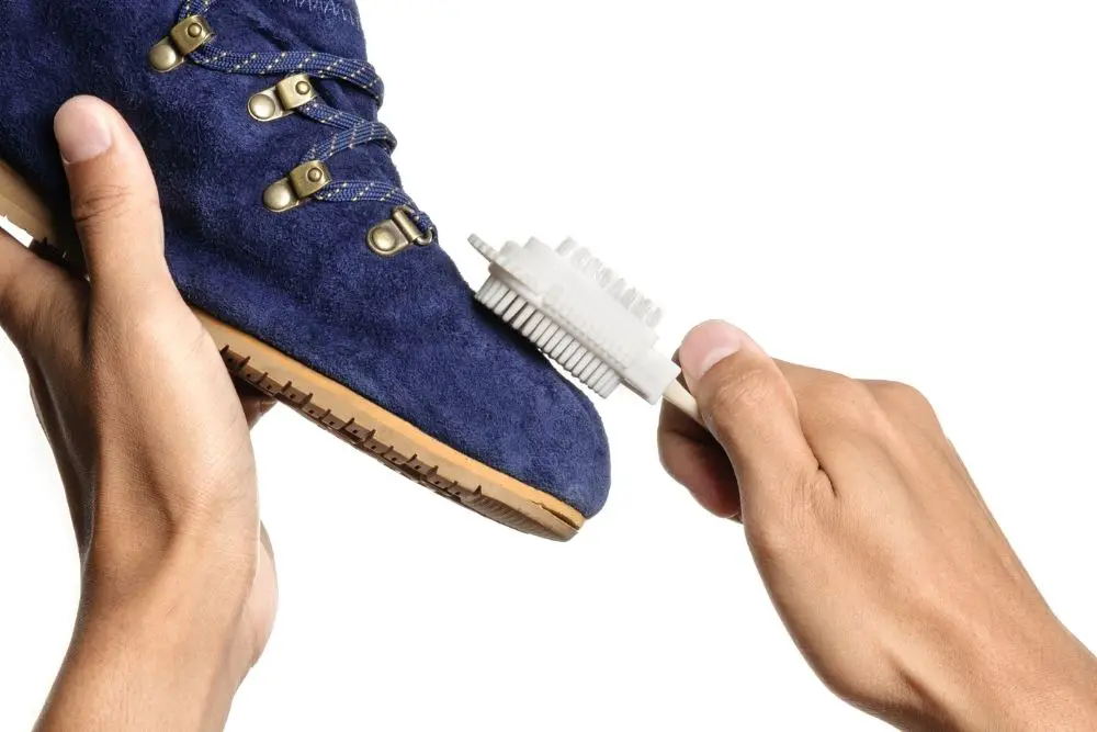 Rub the suede boots with suede brush