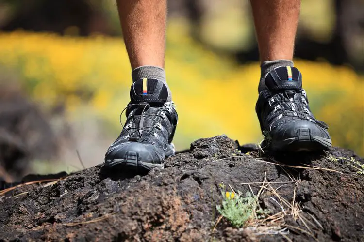 a man wears hiking shoes