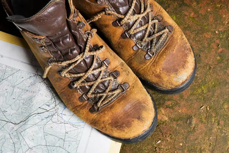 a pair of cracked brown leather hiking boots