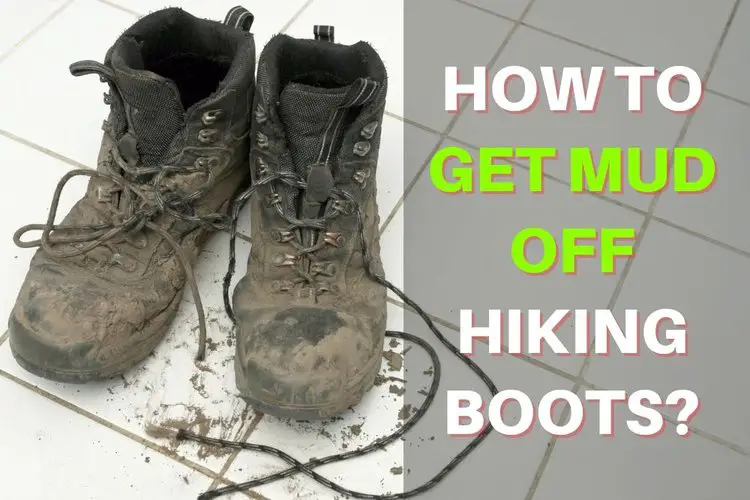 a pair of hiking boots with dry mud on the floor