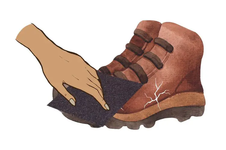 use sandpaper to sand the cracks of suede hiking boots