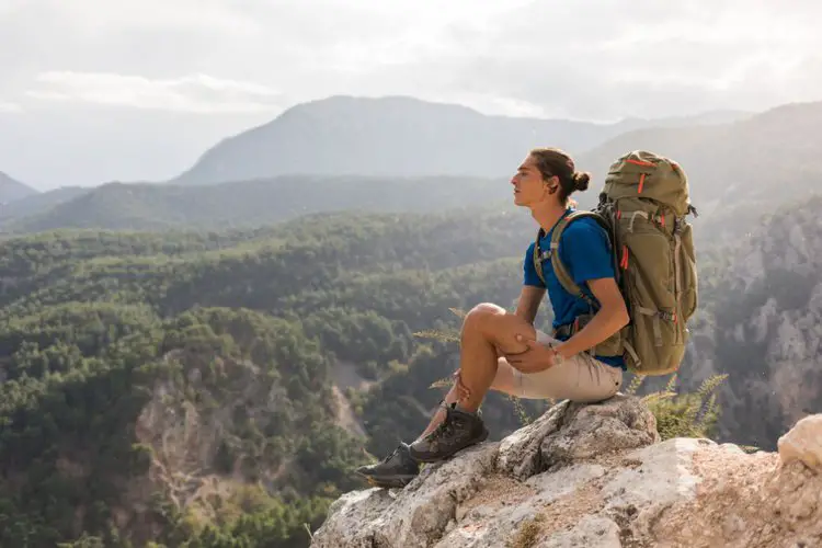 a man goes hiking for multiple days with big hiking backpack