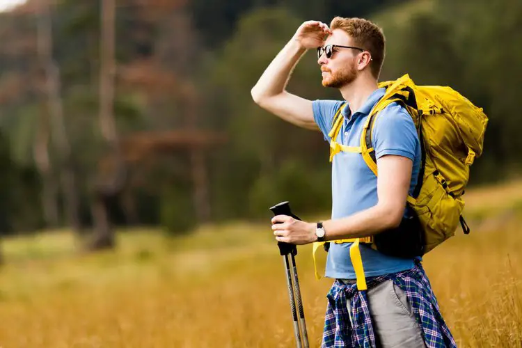 a man wears hiking backpacks with sternum strap around the chest