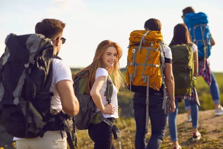 five people go hiking with hiking backpacks