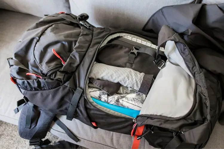 pack clothes in hiking backpack