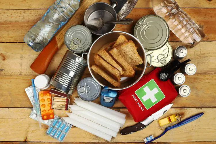 water, food, snacks, first aid kit and other items for hiking trip