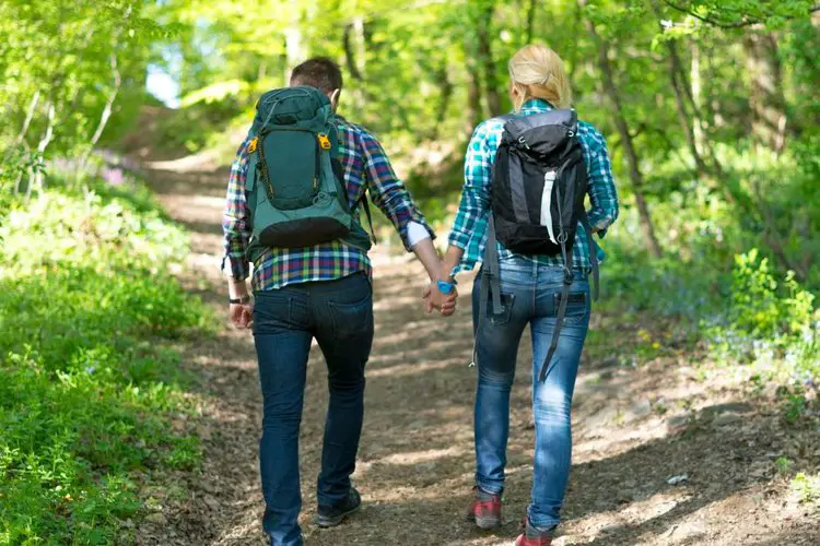 a couple with small hiking backpacks