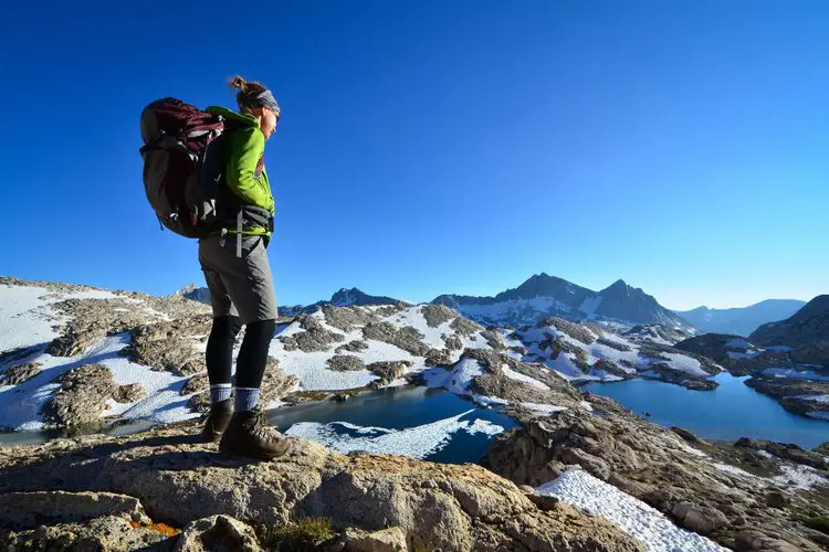 a woman with big hiking backpack