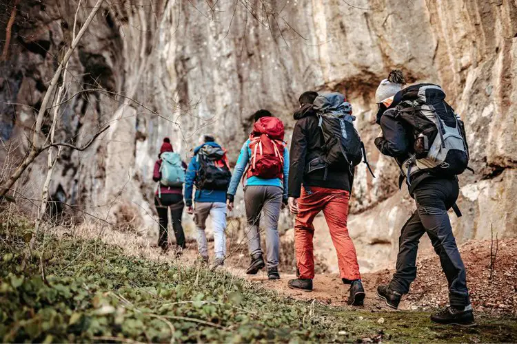 hiking in a group with hiking backpacks