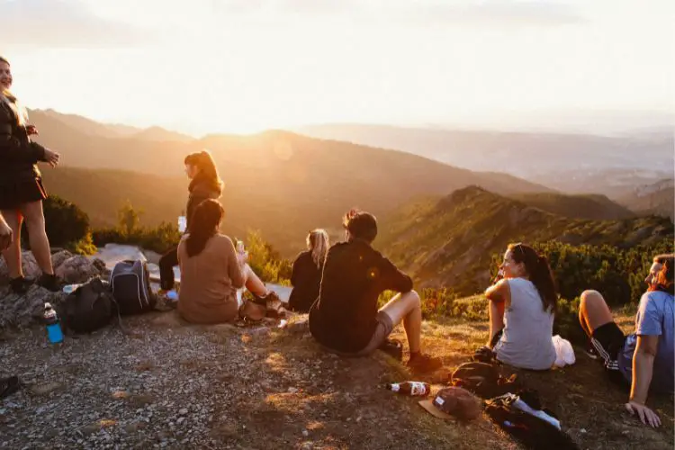 a group takes a rest after hiking