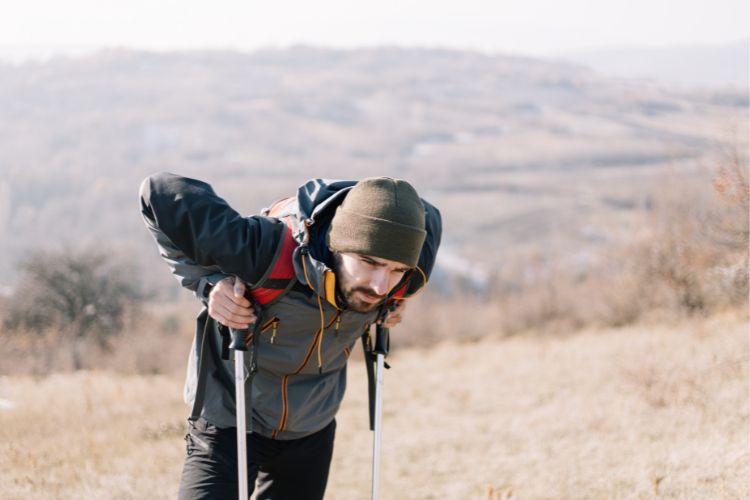 a man gets tired when hiking