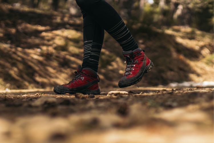 a person wears hiking boots walking