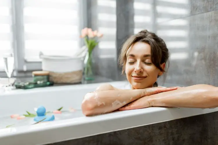 a woman enjoys taking a bath
