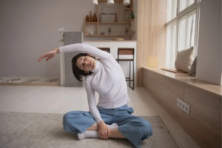 a woman is stretching