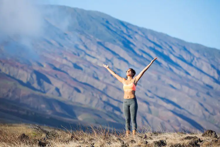 a woman wearing yoga pants enjoys a comfortable trip