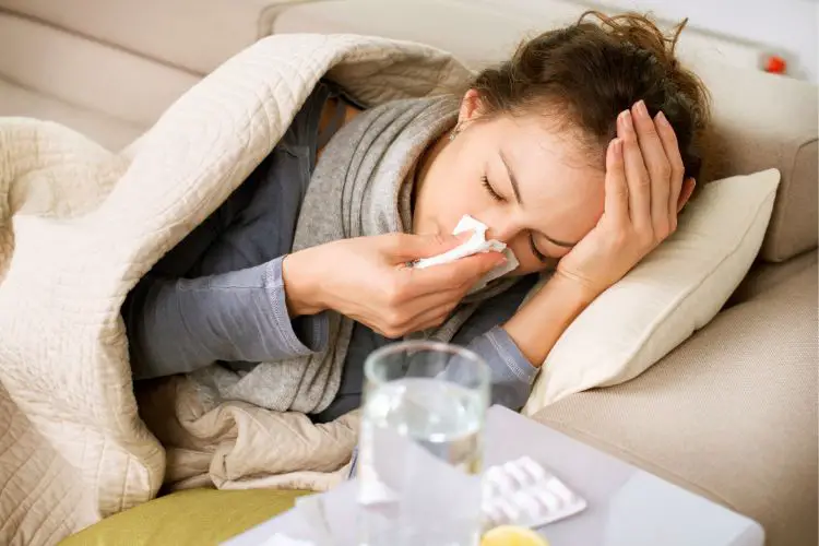 a woman with severve cold symptoms