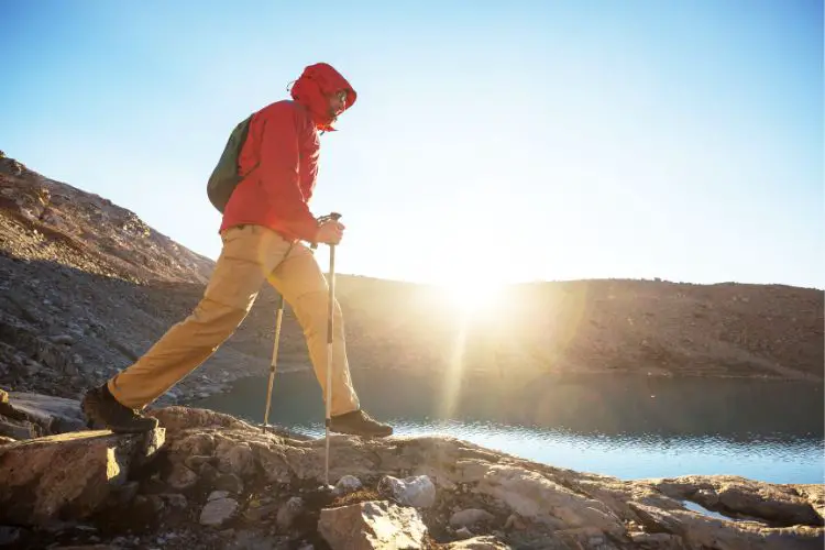 man is hiking on rugged terrain